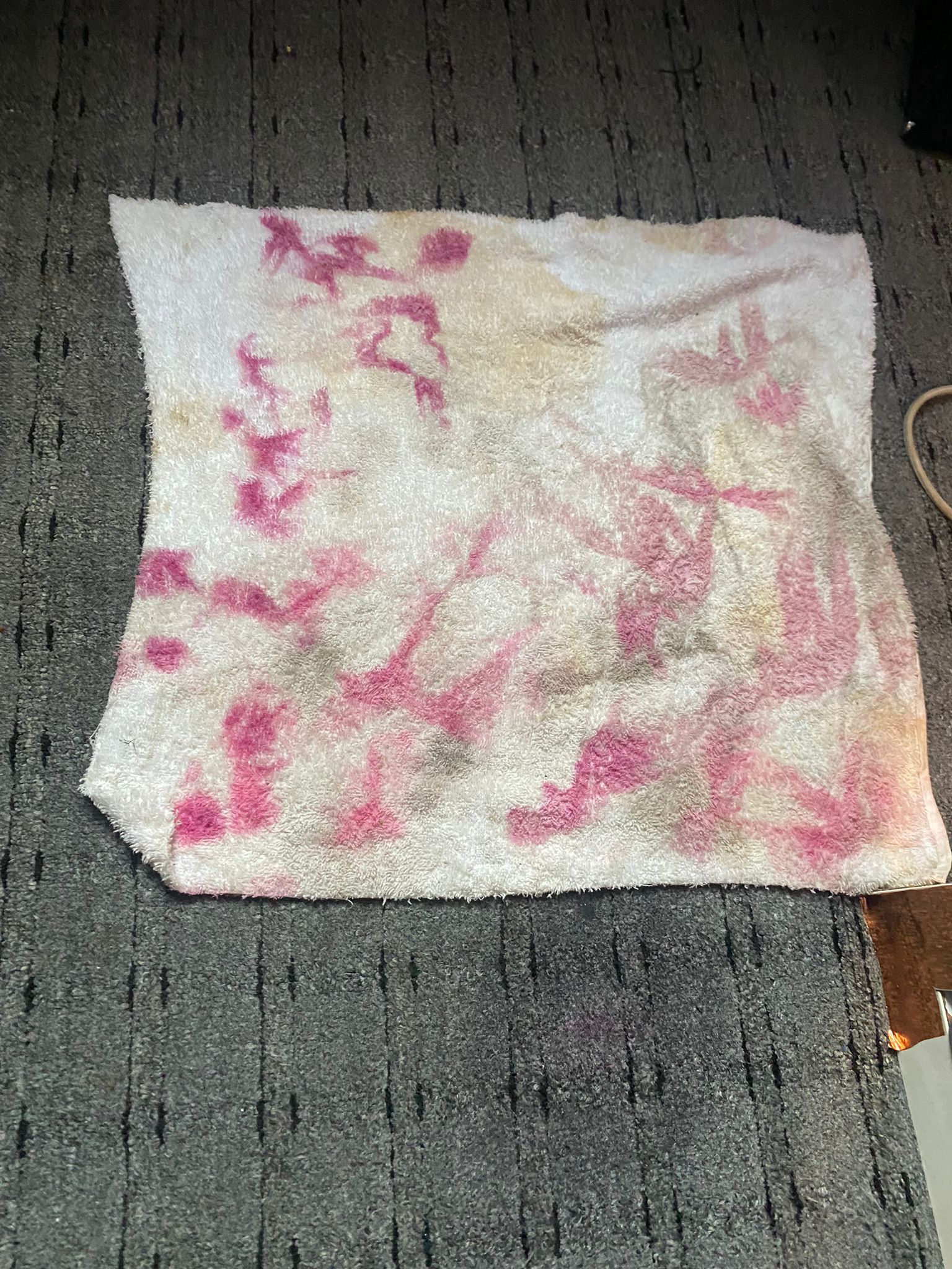 Cloth with pink stains
